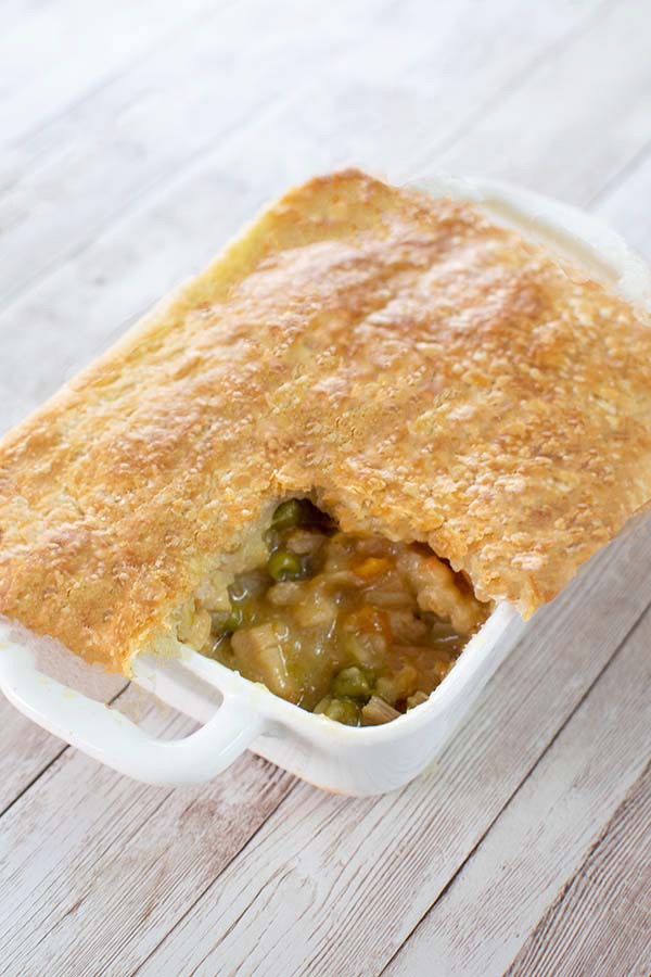 pot pie in a serving dish with a piece cut out