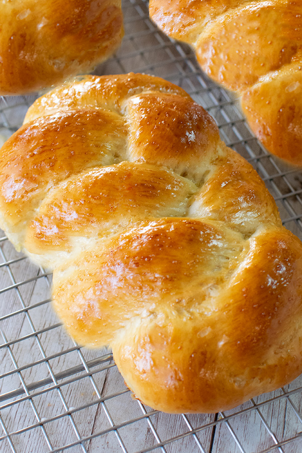 fluffy challah on a cooking rack