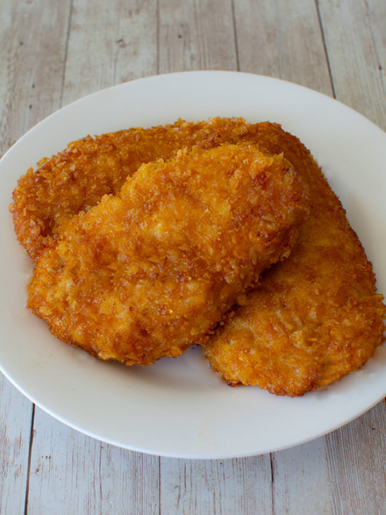 3 cornflake schnitzels on a white plate