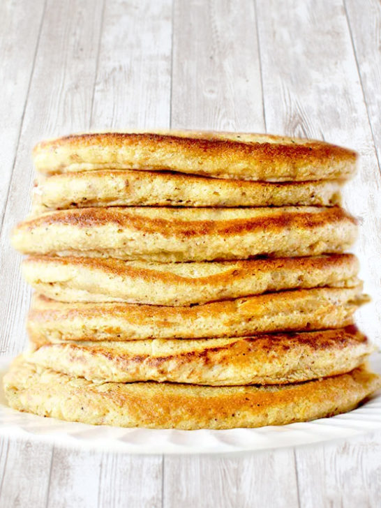 Stack of Passover pancakes on a white wood table