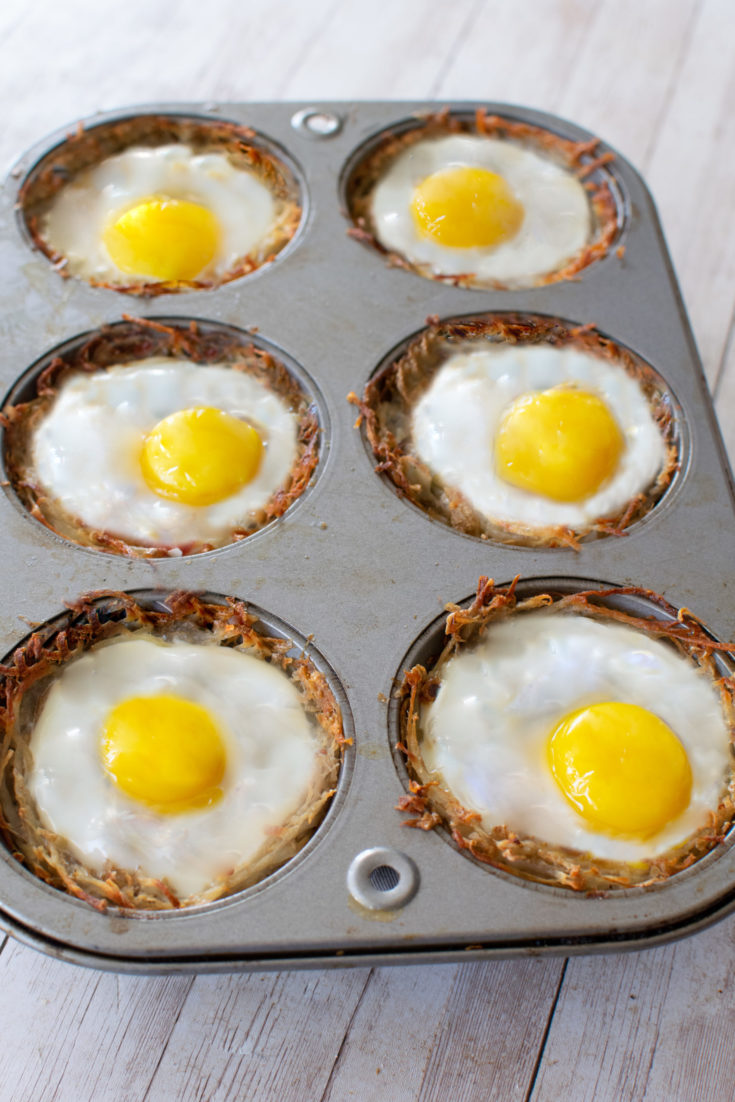 Cooked hash brown cups with eggs