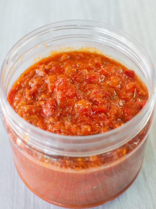 Morccan-Israeli Matbucha in a clear round container.