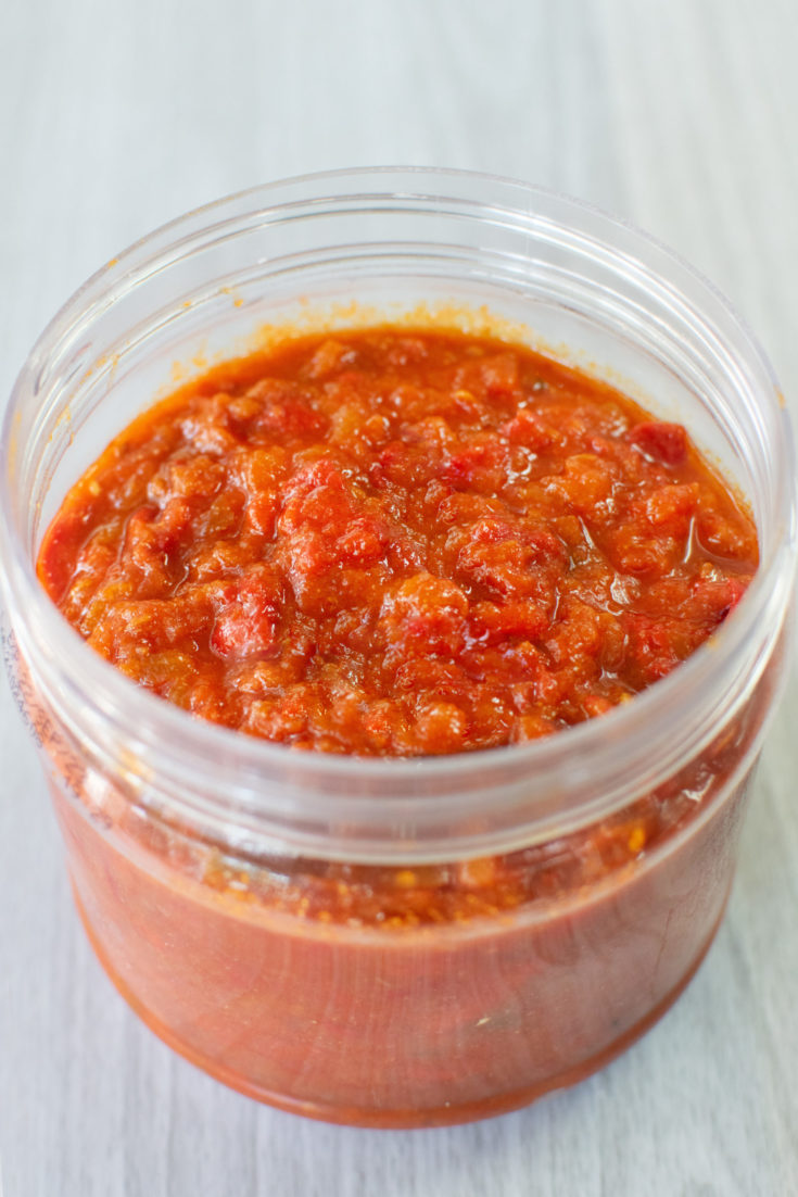 Morccan-Israeli Matbucha in a clear round container.