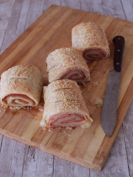 Easy Deli rolls on a cutting board with a knive nearby