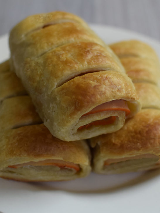 Personal Delli rolls on a white plate on a white wood table